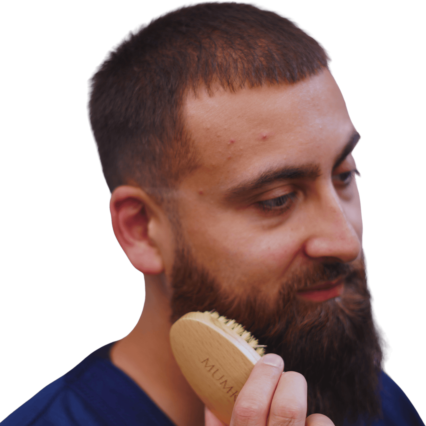 Man grooming beard with Mumkin Vegan Beard Brush natural beech wood handle and sisal plant fiber bristles for even oil distribution, detangling, and healthy beard styling.