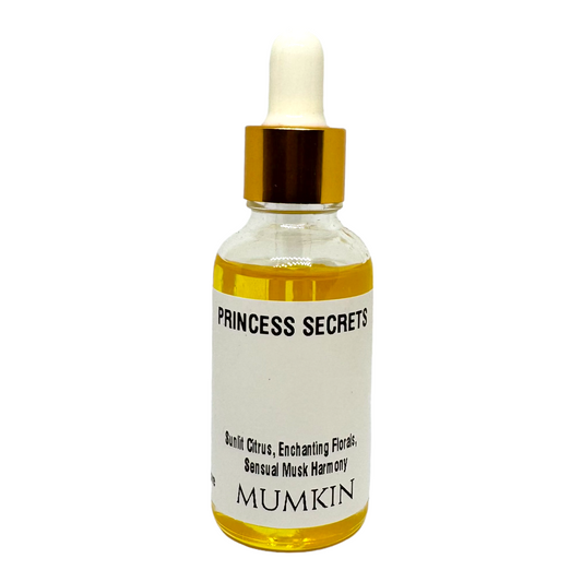 A clear glass dropper bottle labeled 'Princess Secrets' by MUMKIN, filled with golden-yellow oil. The label describes the fragrance profile as having 'Sunlit Citrus, Sensual Musk Harmony.' The product is set against a plain white background.